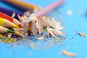 Sharpen the colored pencils with a sharpener.