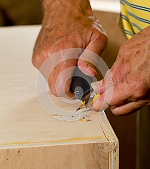 Sharpen a pencil with blade