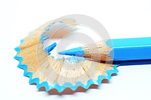 Sharpened blue color pencil and wood shavings