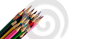 Sharpened colored pencils on a white background. Banner