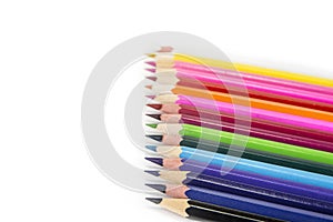 Sharpened colored pencils on the white background.