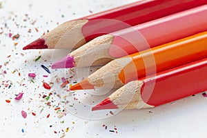 Sharpened colourful pencils on white paper