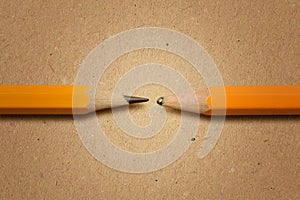 Sharpened pencil versus dull pencil on recycled paper background - Concept of innovation and creativity