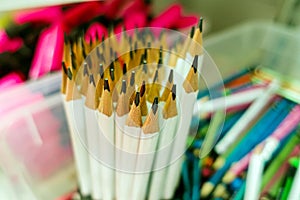 Sharpened pencils standing upright in a stand