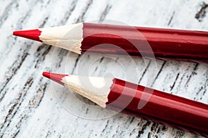 Sharpened Red Pencils with Red Body on White Background