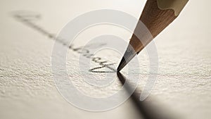 A sharpened wooden pencil with a