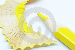 Sharpened yellow color pencil and wood shavings