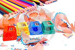 Sharpeners and pencils on a white background.