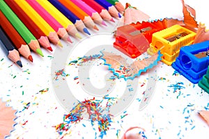 Sharpeners and pencils on a white background.