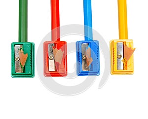 Sharpeners and pencils on a white background.