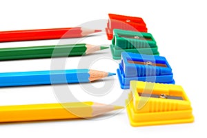 Sharpeners and pencils on a white background.