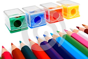 Sharpeners and pencils on a white background.