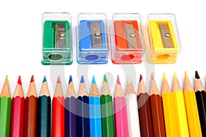 Sharpeners and pencils on a white background.