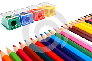 Sharpeners and pencils on a white background.