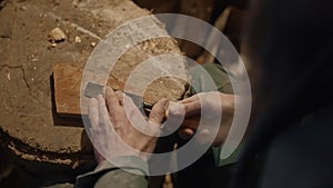 Sharpening a chisel with a whetstone