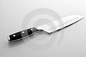 Sharpening the knife with whetstone on white background.