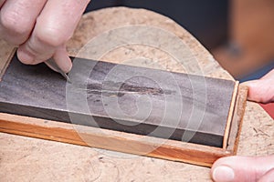 Sharpening stone with graver