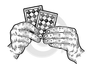 A sharpie holds two cards in his hands. Scratch board imitation. photo