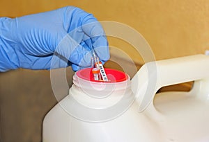 Sharps container for needles