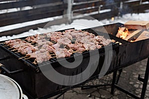 Shashlyk to prepare on an open fire in a mangale. outdoors