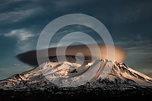 Shasta view with a brown volcano cloud on the top and a gloomy sky background