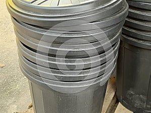 Shatter-resistant plastic water buckets stacked neatly so they don& x27;t take up much space.