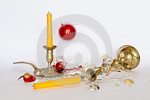 Shattered Christmas baubles and bronze candleholders