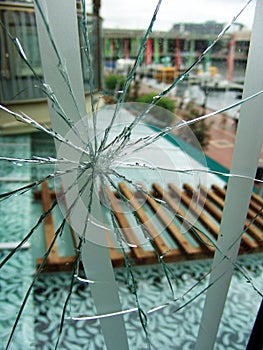 Shattered glass window near a glass roof