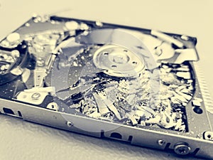 Shattered platter of computer hard drive disk.