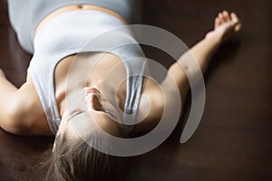 Shavasana yoga posture on the floor photo