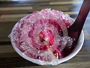 Shaved ice on bread include grenadine in cup