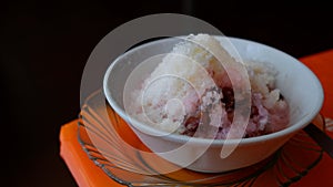 Shaved ice with red beans, cassava tape, cendol and sweetened condensed milk photo