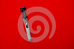 Shaver on a red background
