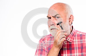 Shaving razor blade tool kit. mature bearded man isolated on white. unshaven old man has moustache and beard. cut and