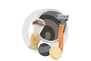 Shaving supplies and mirror against white