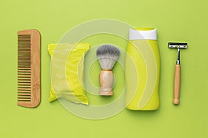 Shaving and washing kit on a green background