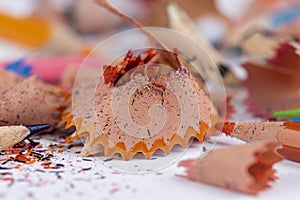 shavings and pieces of lead on paper after sharpening pencils