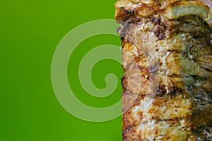 Shawarma meat is grilled on a skewer in restaurant