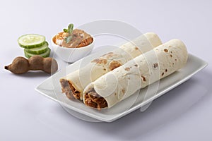 Shawarma sandwich fresh roll of, Grilled Meat and salad tortilla wrap with white sauce isolated on white background. Image