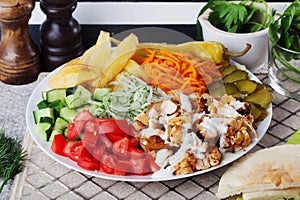 Shawarma still life on a plate top of meat chicken cabbage carrot onion pepper durum