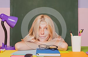 Shcool teacher in class on blackboard background. Professional portrait.
