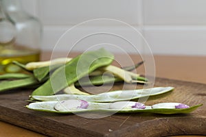 Sheaf of open garrofon with raw beans photo
