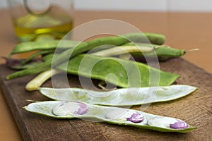 Sheaf of open garrofon with raw beans photo