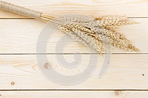 Sheaf of Wheat over Wood Background. Harvest concept. Top view