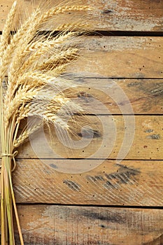 Sheaf of Wheat over Wooden table