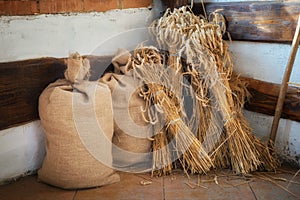 Sheaves of wheat spikelets and bags of flour