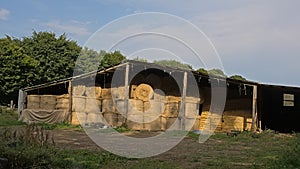 Shed with haystacks in the walloian countryside