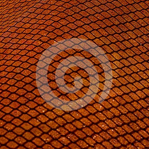 Shedow of weaved wire net on rusty metal sheet. Surface with depth of field, abstract industrial mesh background