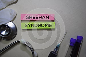 Sheehan Syndrome text on Sticky Notes. Top view isolated on office desk. Healthcare/Medical concept