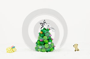 Sheep and dog looking Christmas tree isolated on white background